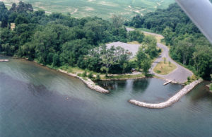 Aerial photo of Deans Cove State Boat Launch Area showing launch basin, parking area and entrance road